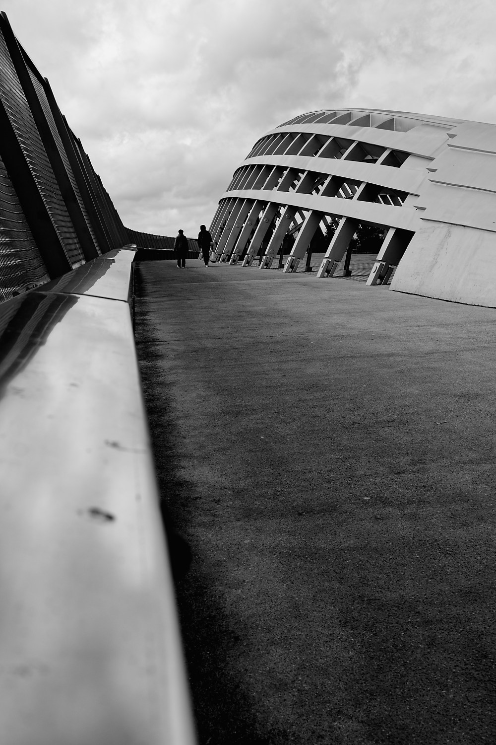 Figures on bridge — In Transit